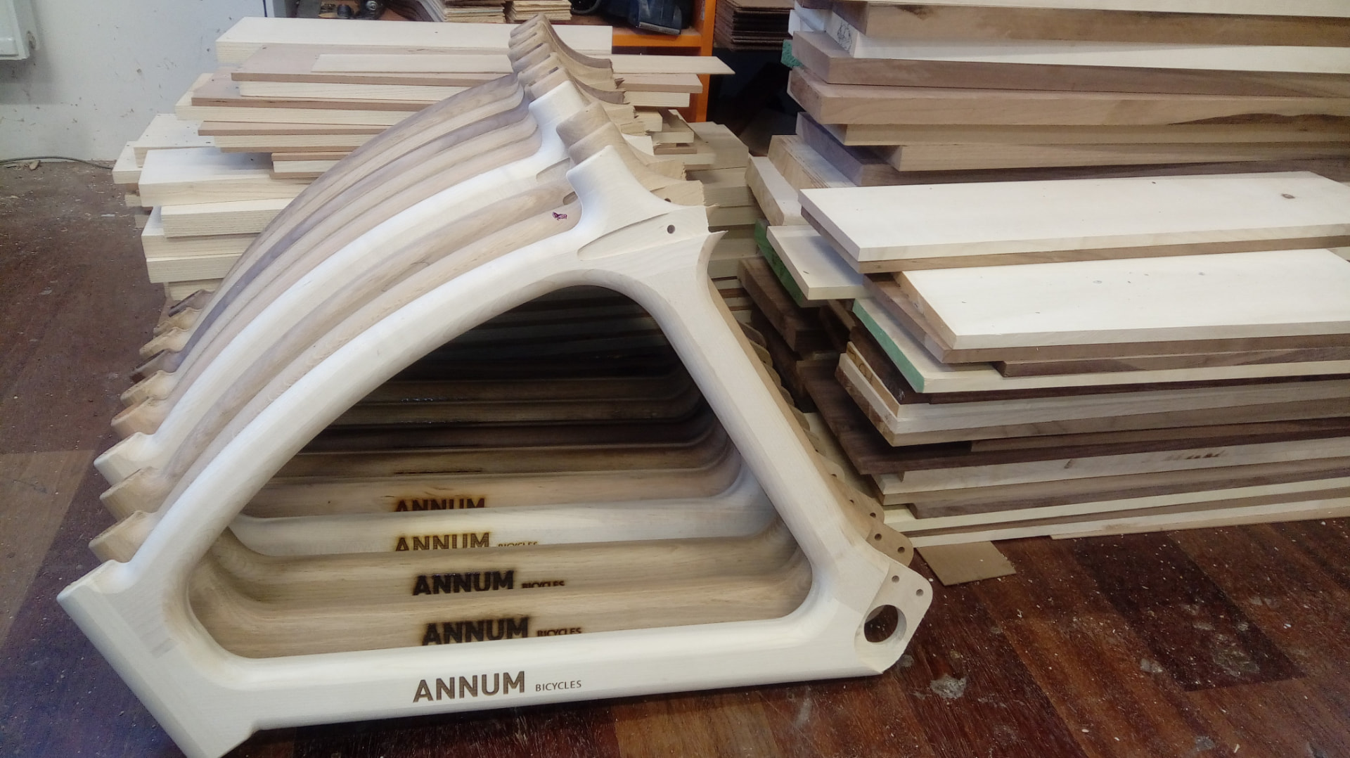 Handcrafted Annum wooden bicycle frames showing the natural wood grain